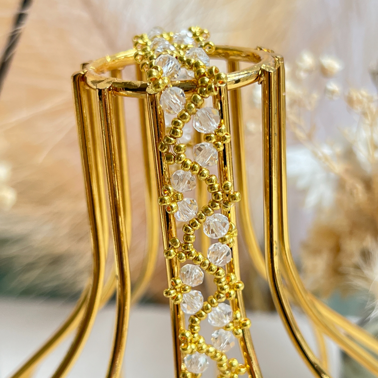 Close-up of handmade beaded bracelet with intricate design