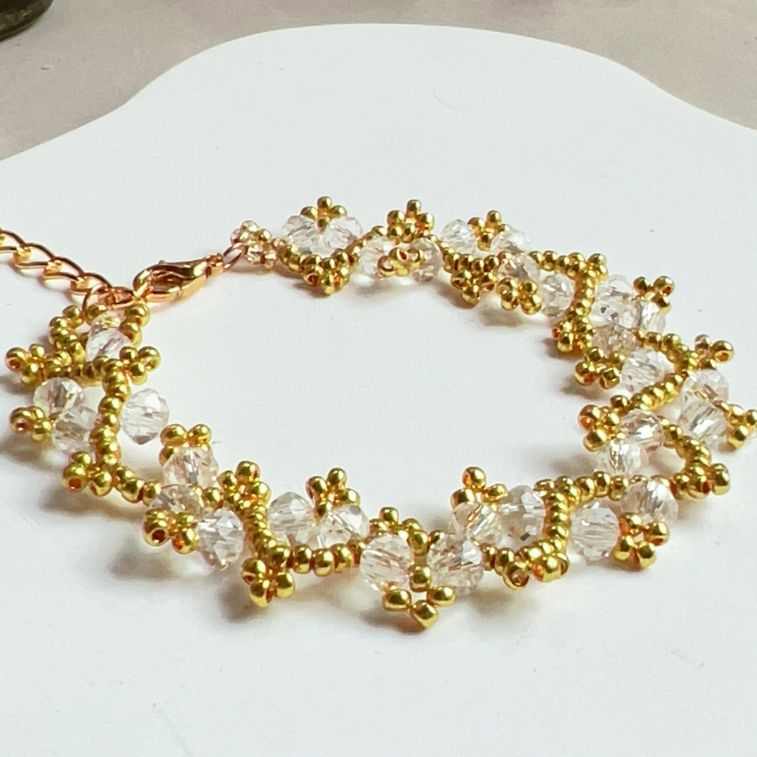 Close-up of a bracelet with flat wheel-shaped beads, showcasing minimalist and elegant design