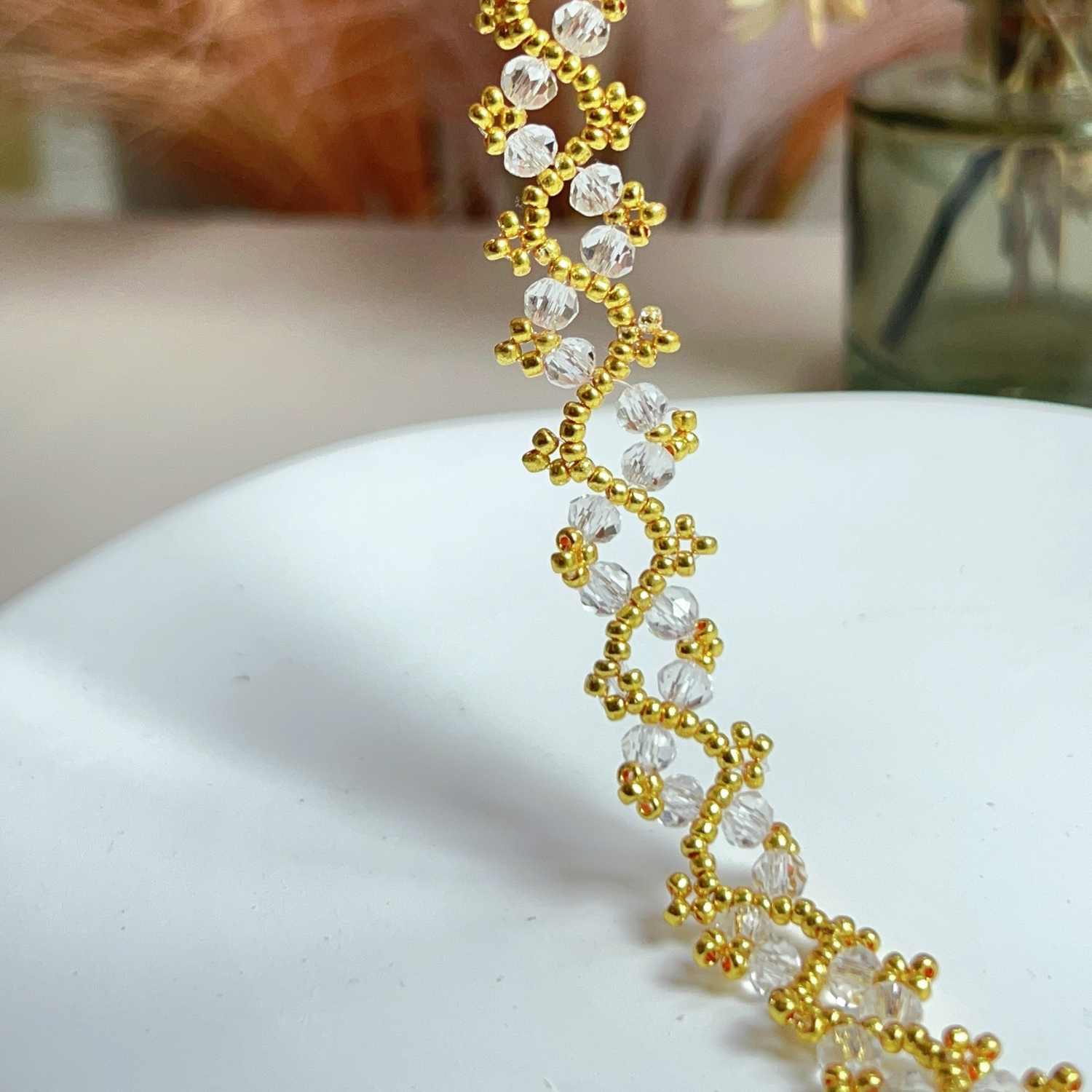 Zoomed-in shot of a transparent flat bead bracelet with delicate craftsmanship