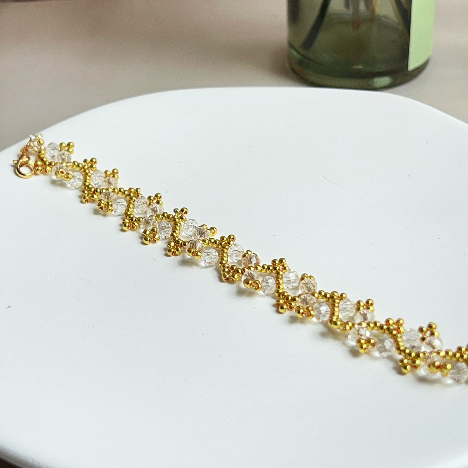 Crystal-clear glass bead bracelet with a sleek, modern aesthetic – detail shot