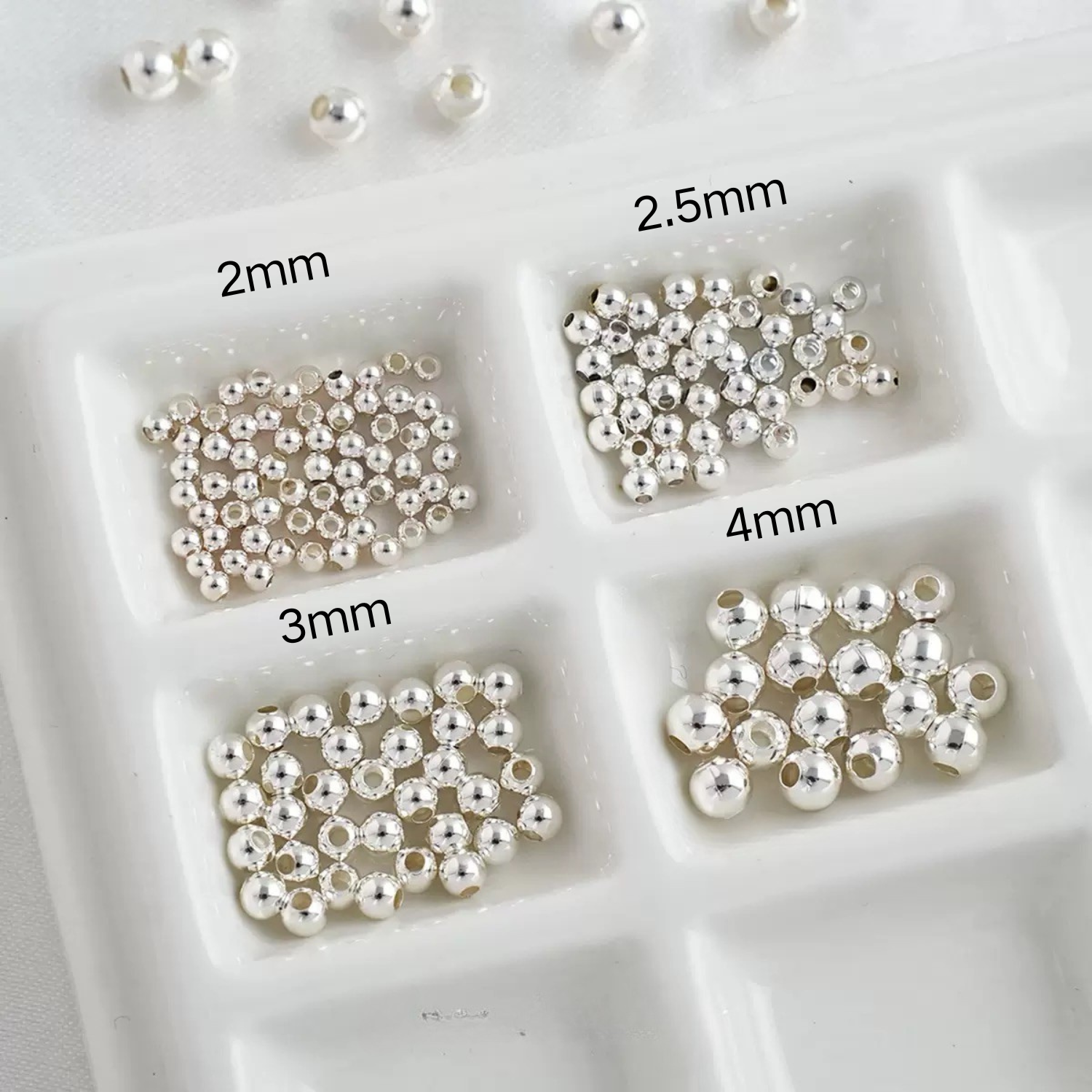 Silver seed beads in four different sizes for versatile jewelry making