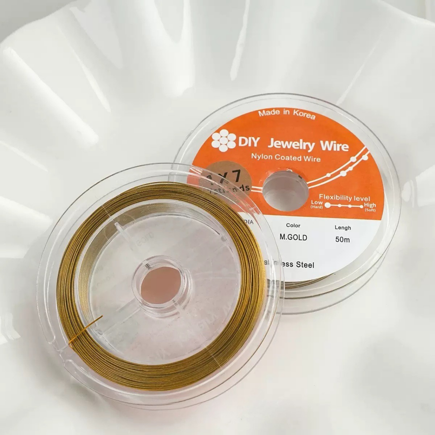 Double-sided display of dark gold beading wire for DIY jewelry