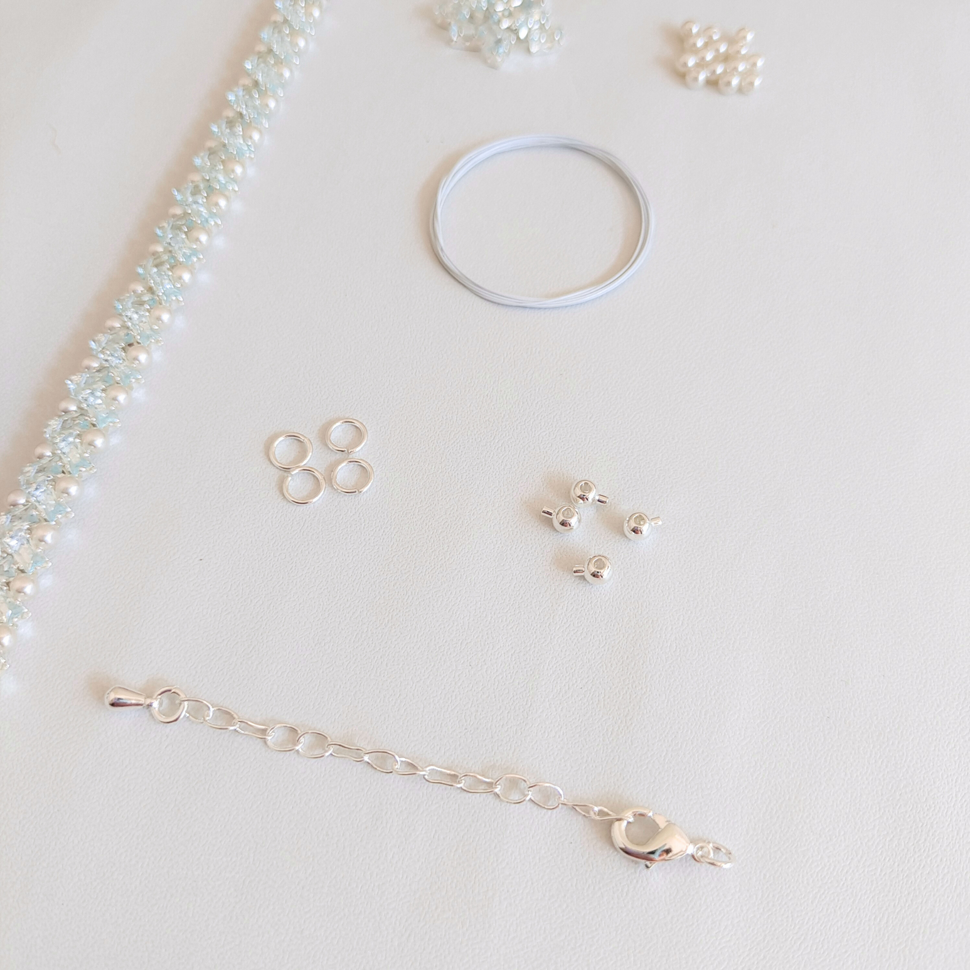 DIY bracelet set with ice blue claw-set zircon, white pearls, and all included materials