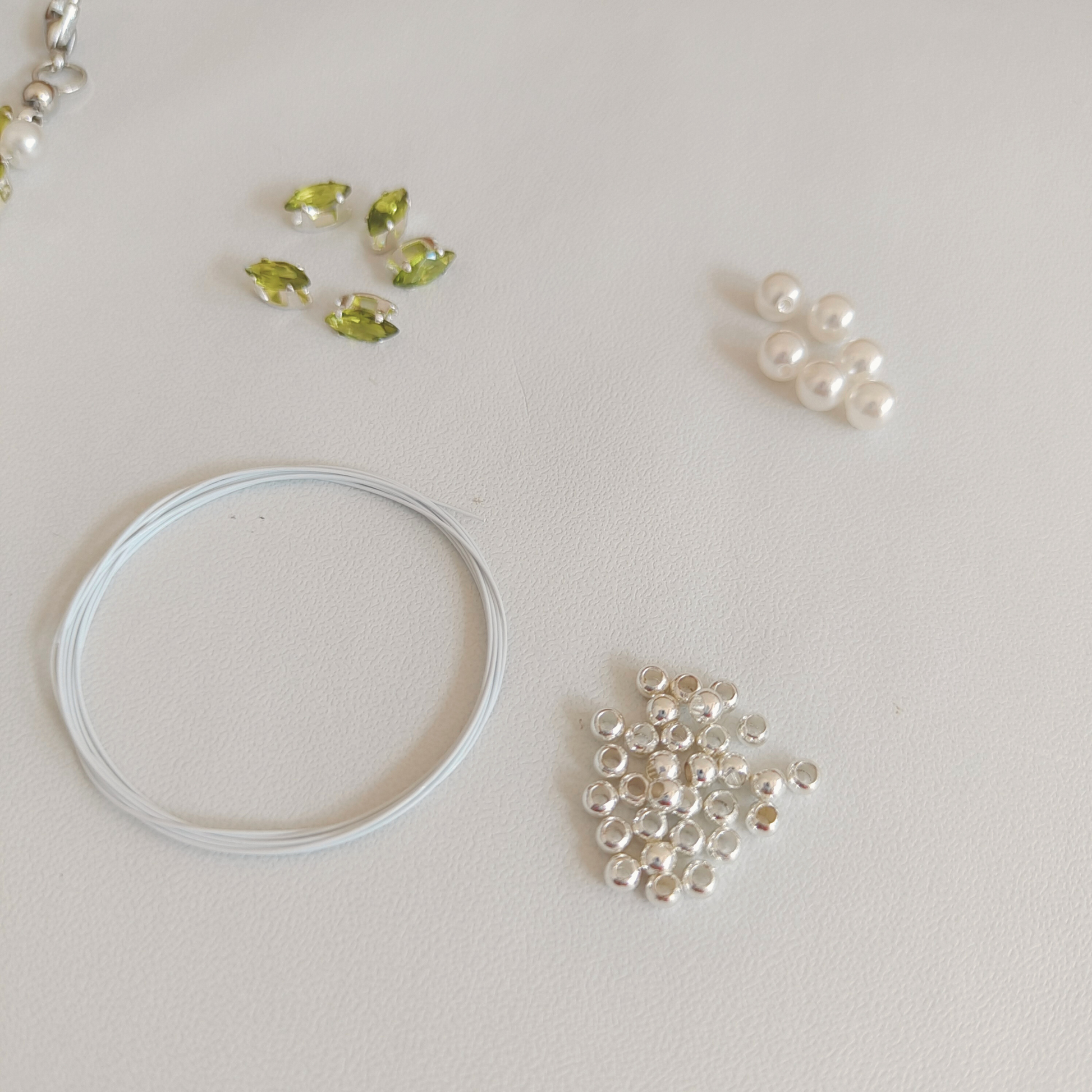 Beaded olive green zircon and pearl bracelet with materials guide