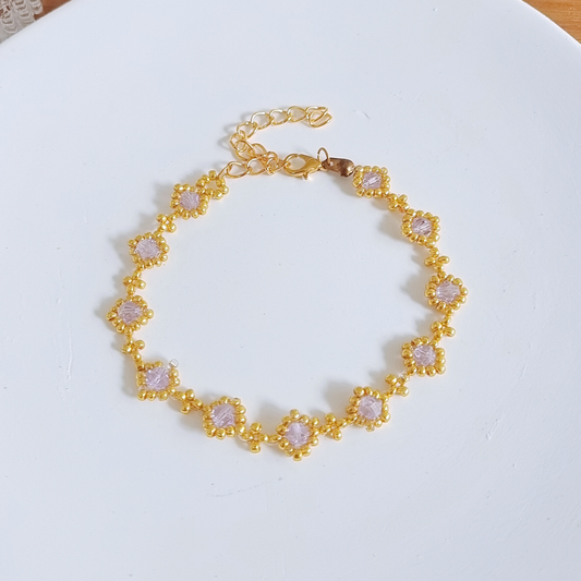 Full view of a handmade beaded bracelet with light purple beads