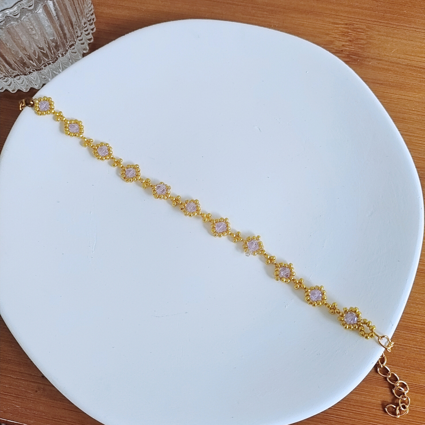 Complete shot of a dainty bracelet made with soft lilac beads
