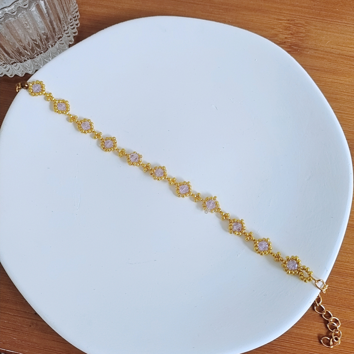 Complete shot of a dainty bracelet made with soft lilac beads