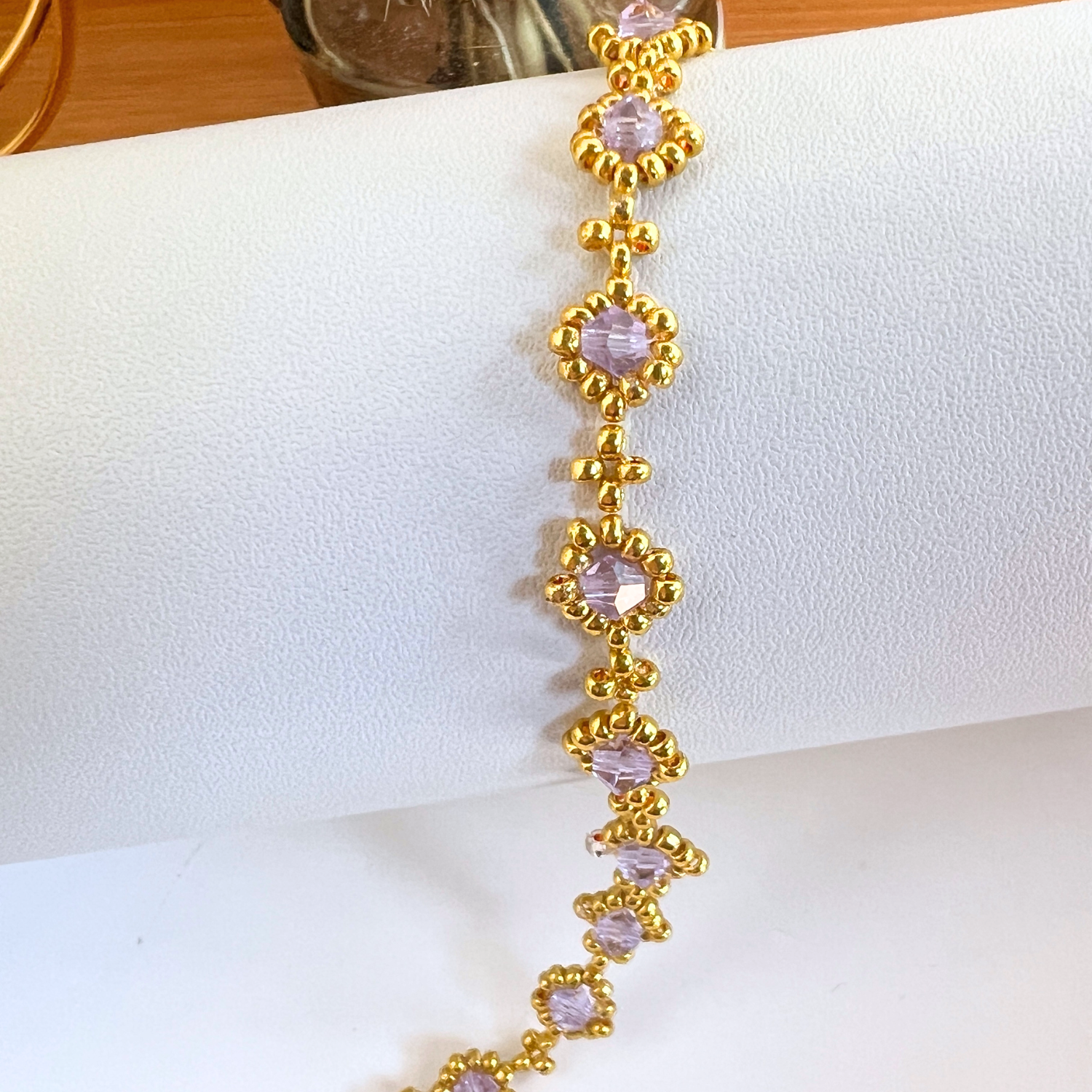Light purple faceted diamond beads strung on a bracelet