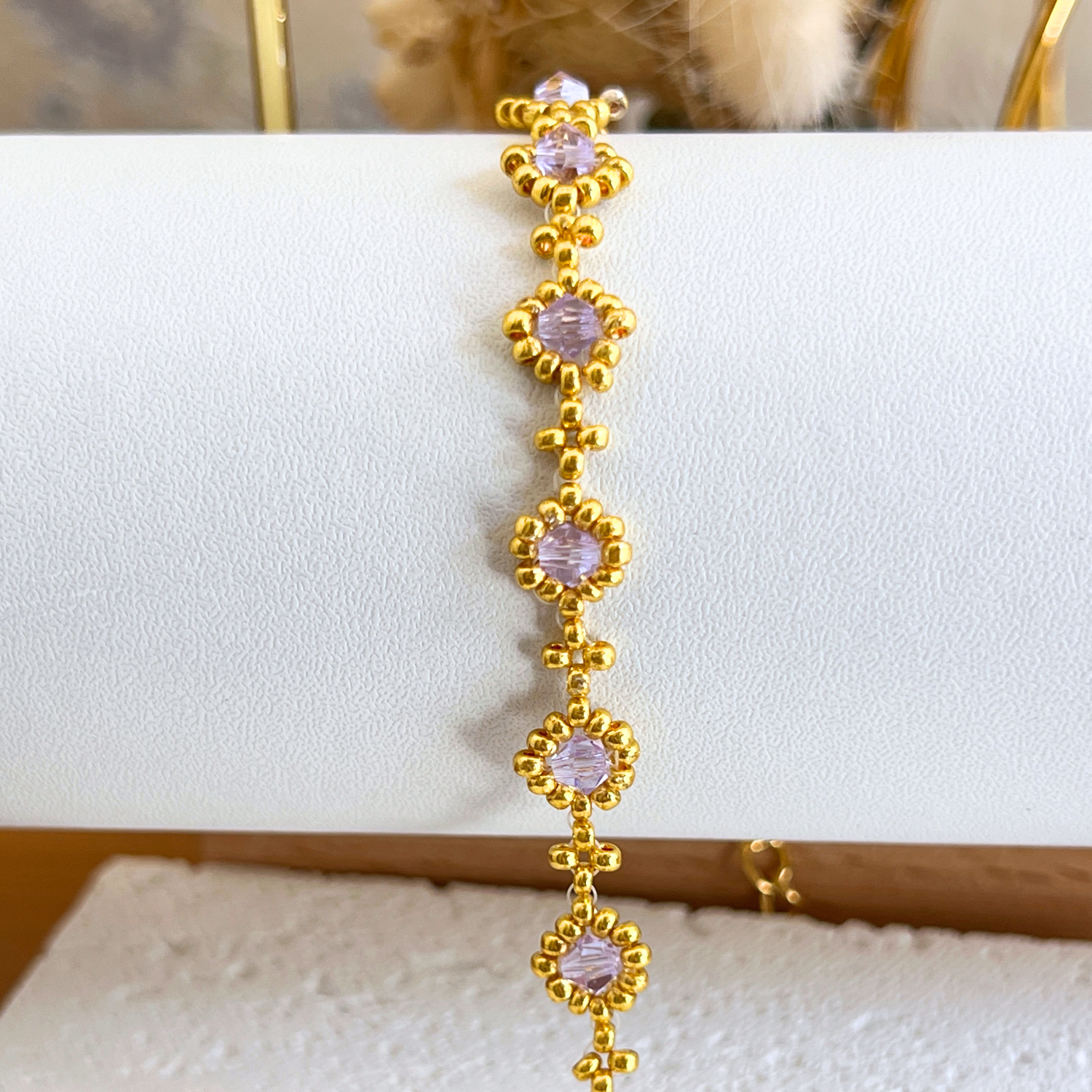 Zoomed-in shot of a pastel purple diamond bead bracelet