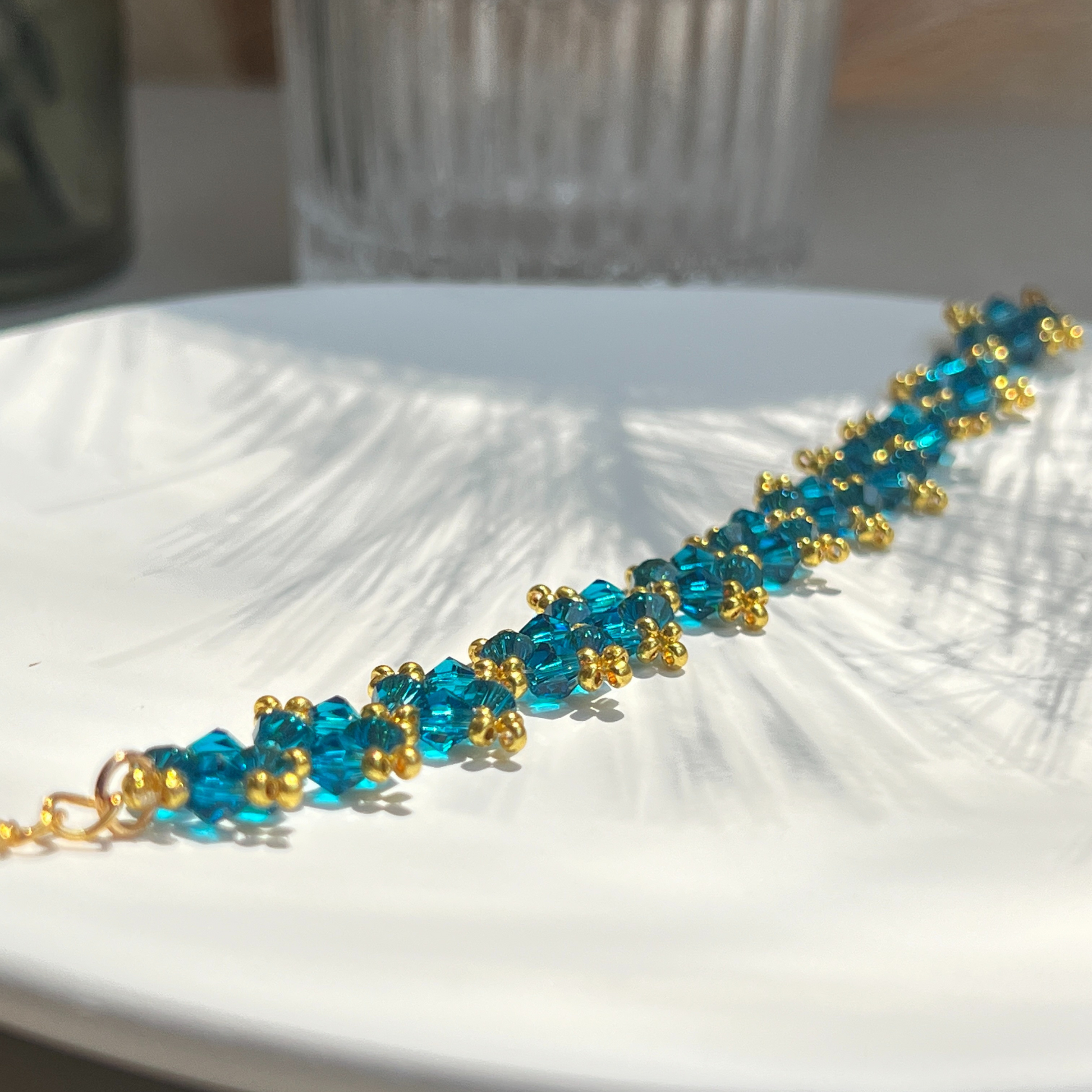 Detailed view of handmade bracelet with navy blue beads