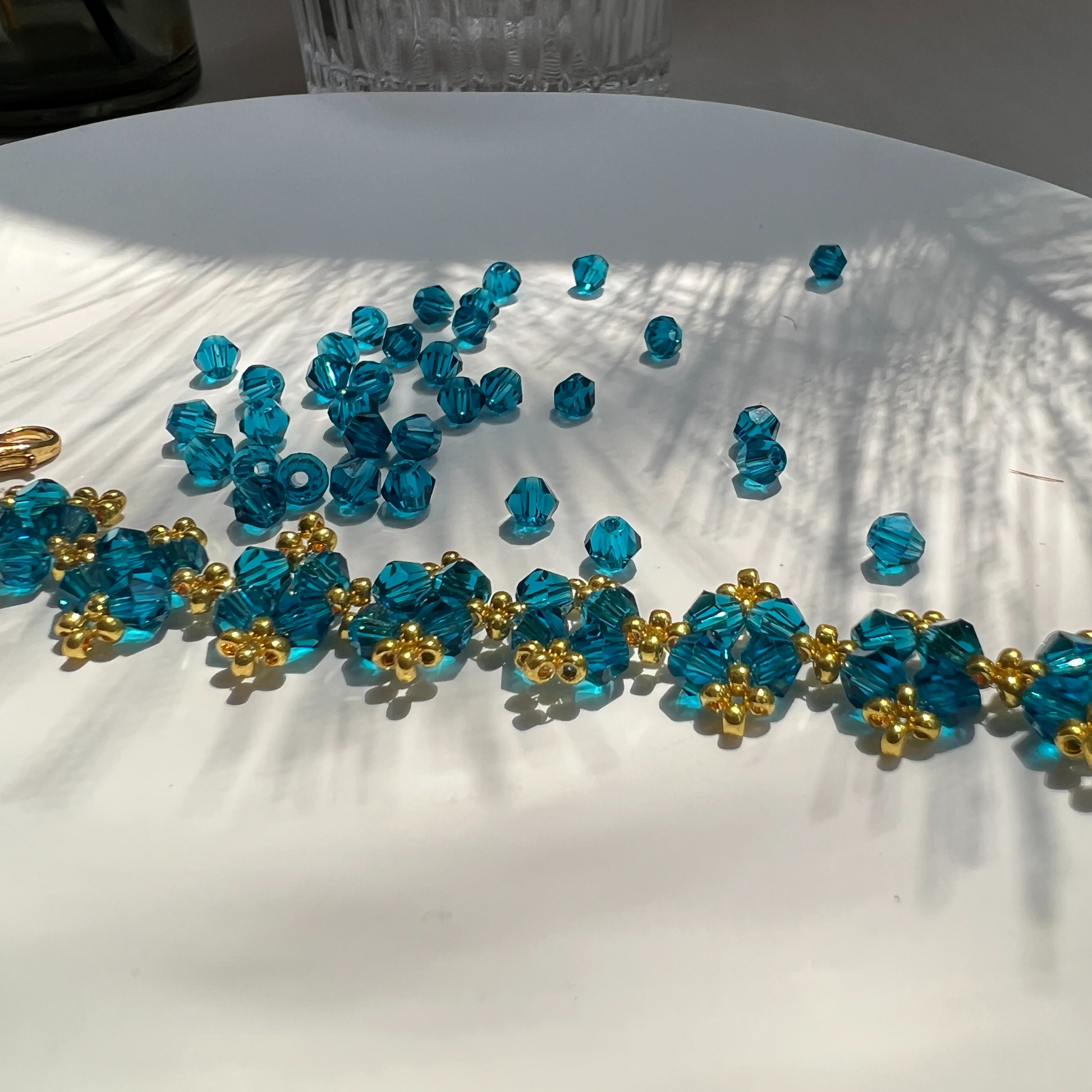 Navy blue faceted diamond beads shown with a finished beaded bracelet