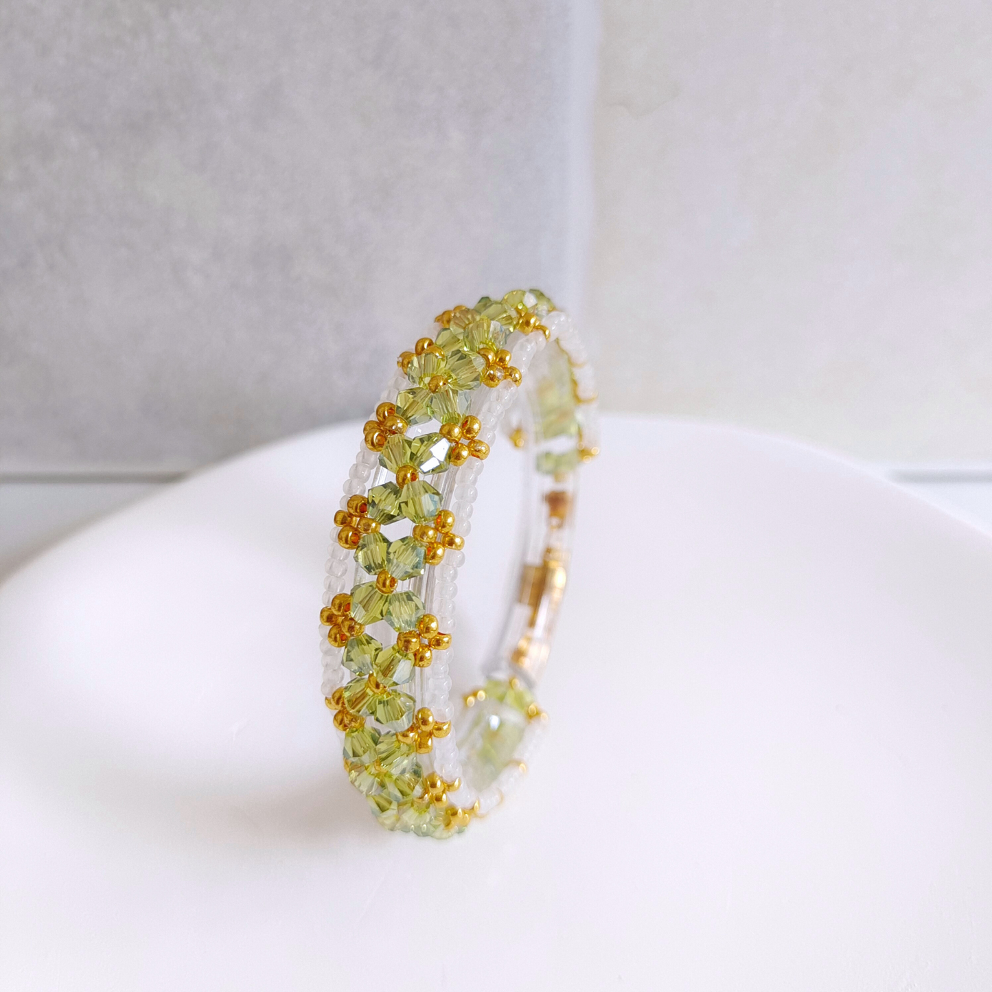 Full view of olive green and white jade beaded bracelet