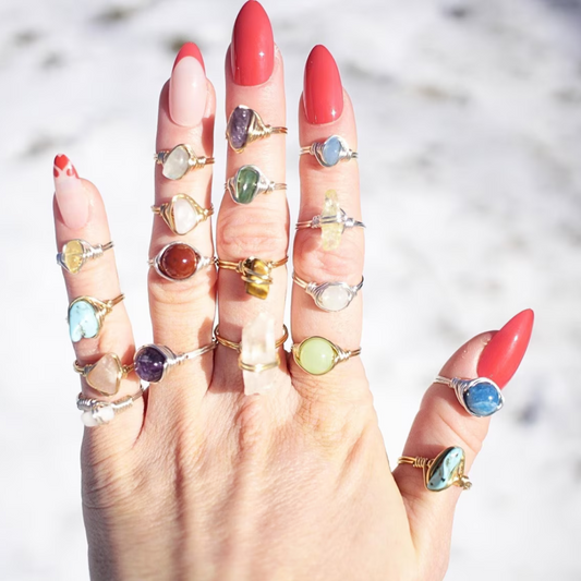 Crystal raw stone rings worn on fingers