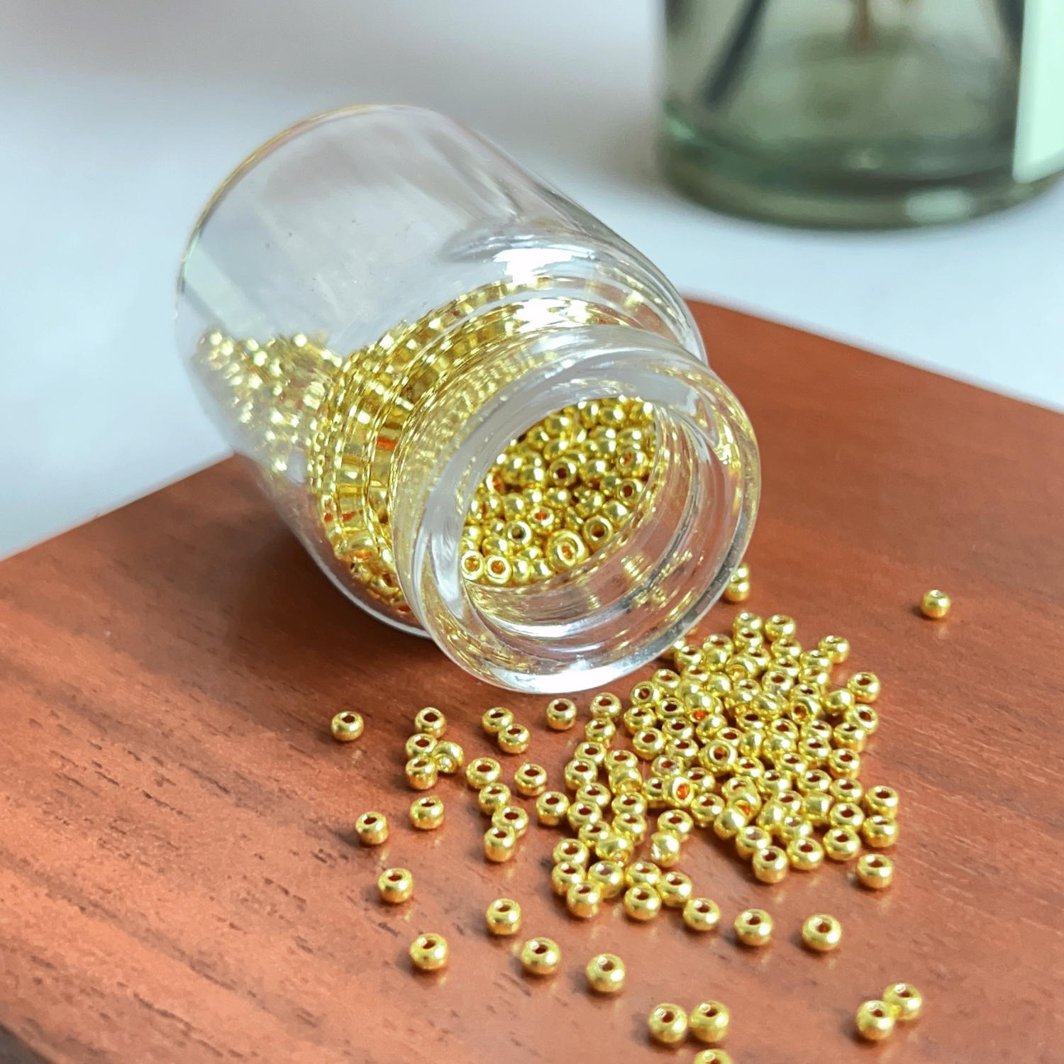 Glass Bottle of Golden Seed Beads