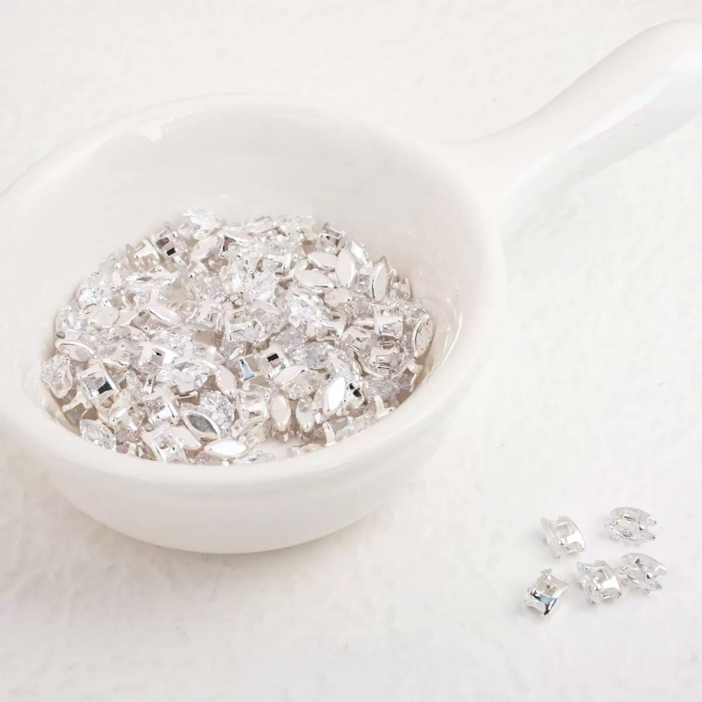 clear faceted marquise CZ gemstones in silver prong settings