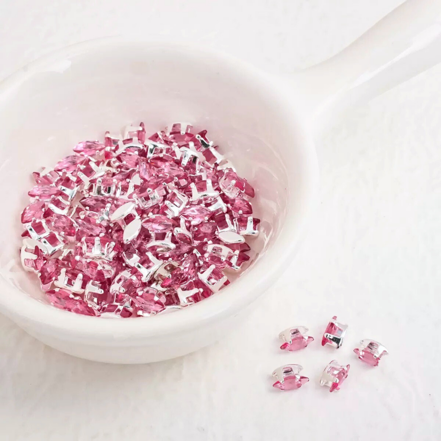 rose pink faceted marquise CZ gemstones in silver prong settings