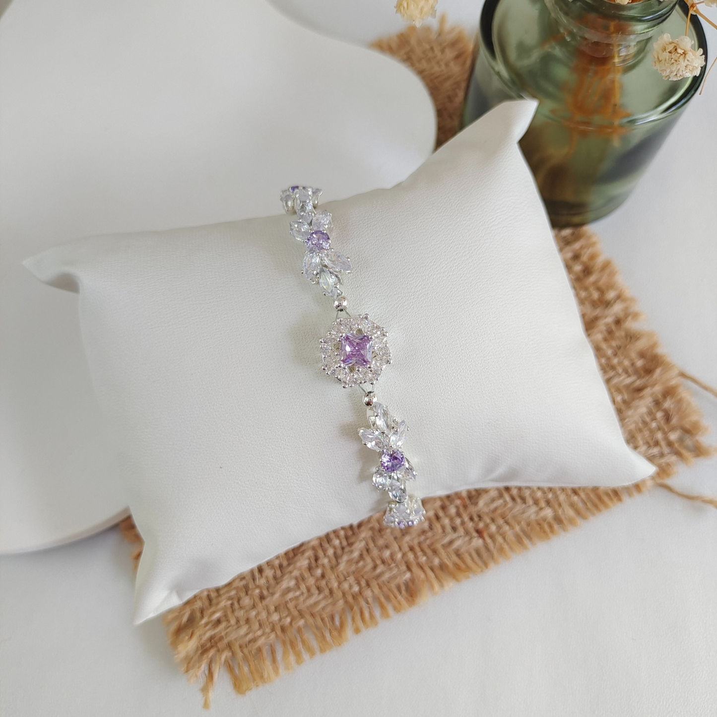 Elegant bracelet featuring marquise and round zircon stones with purple accents