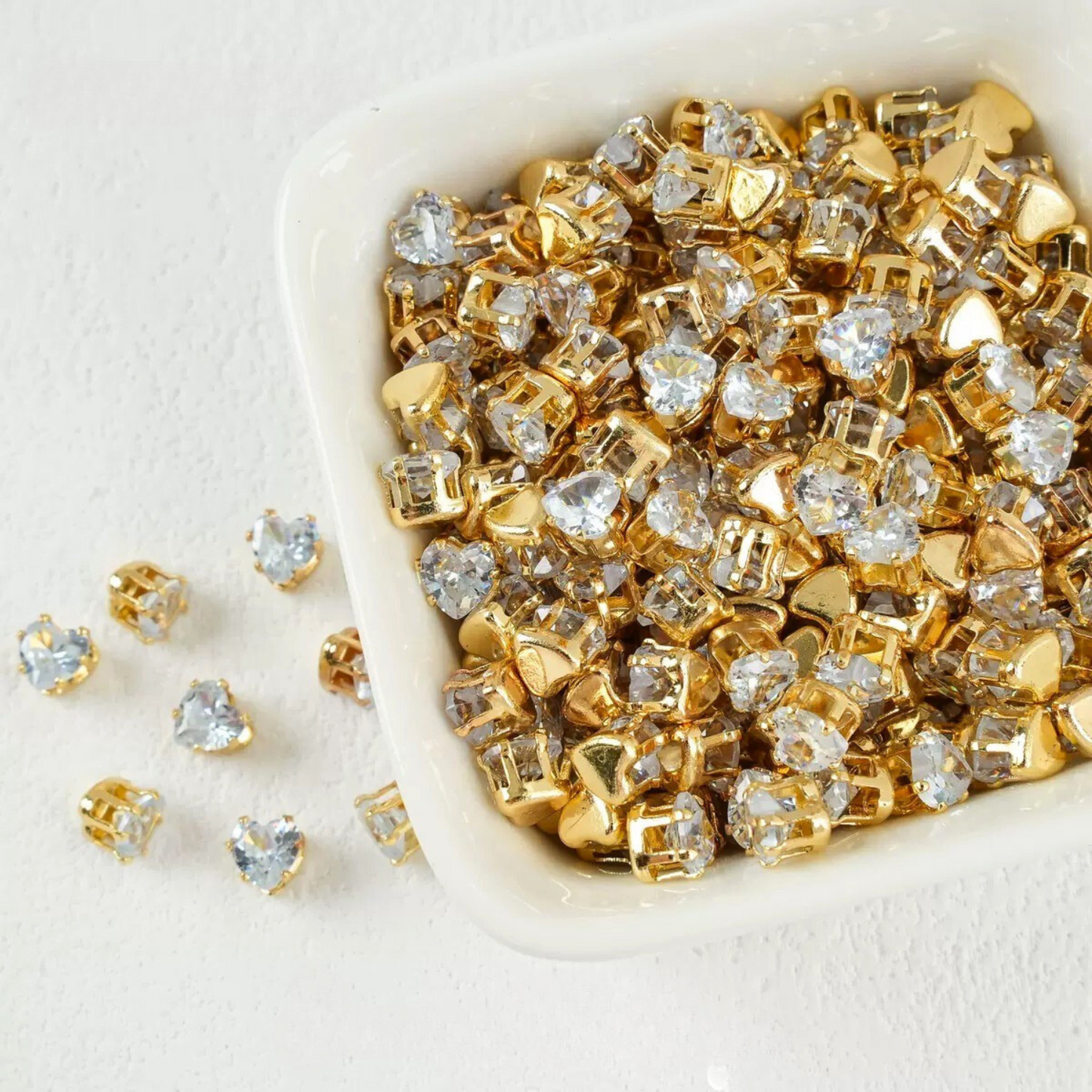Clear heart-shaped cubic zirconia in gold-plated claw setting