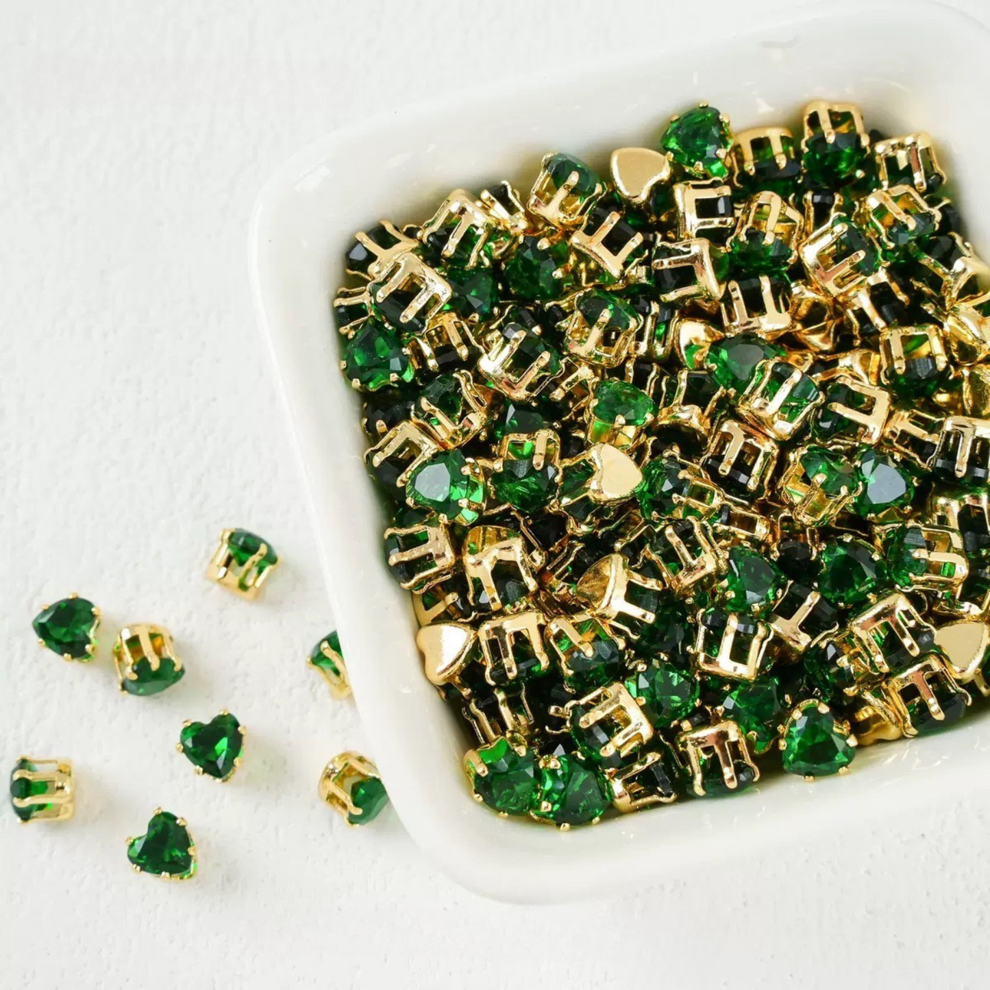 Forest green heart-shaped cubic zirconia in gold-plated claw setting