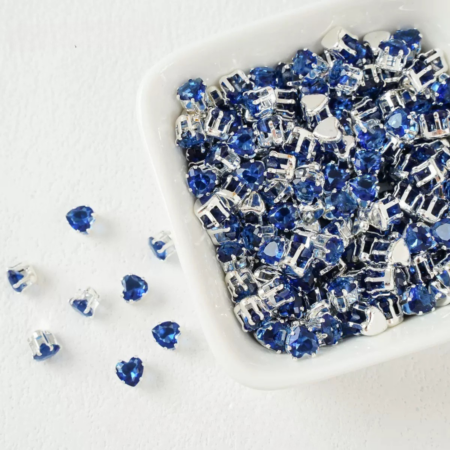 Dark blue heart-shaped cubic zirconia with silver-plated claw setting