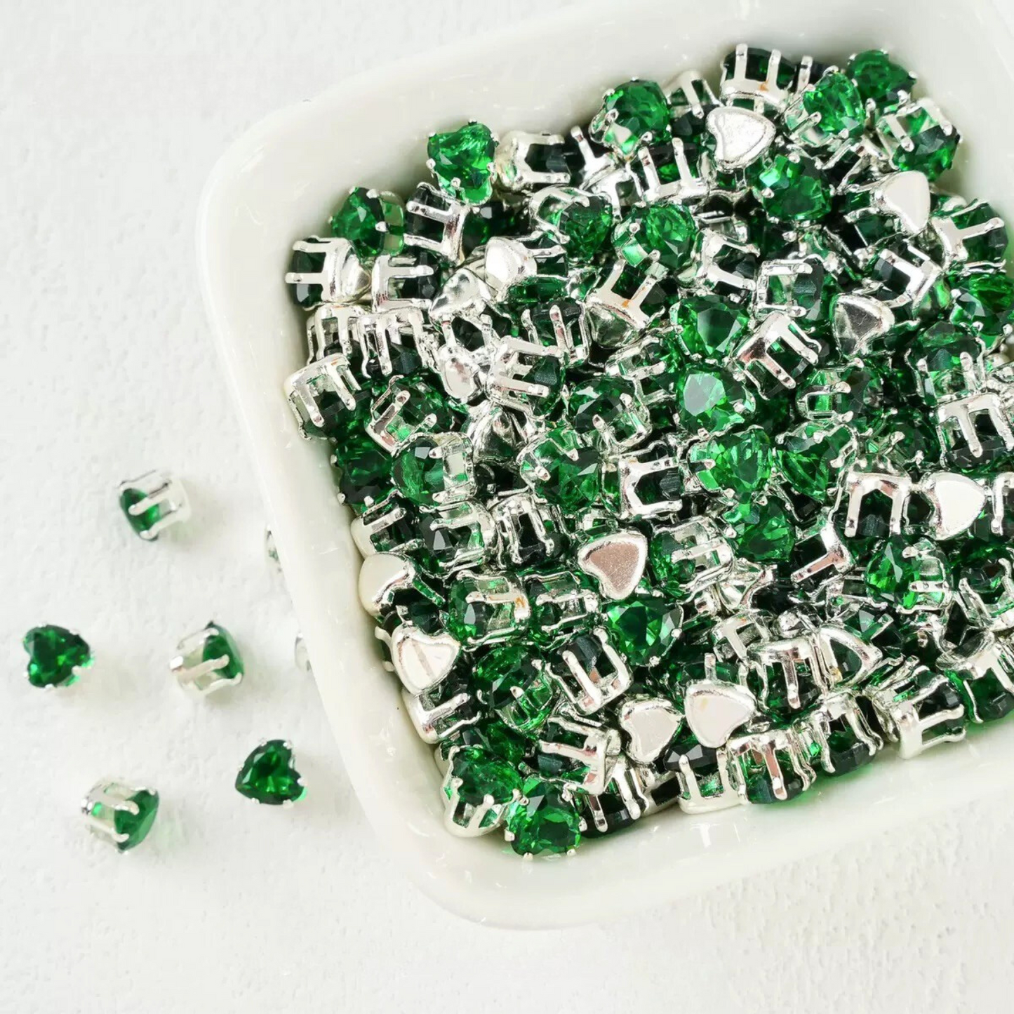 Forest green heart-shaped cubic zirconia with silver-plated claw setting