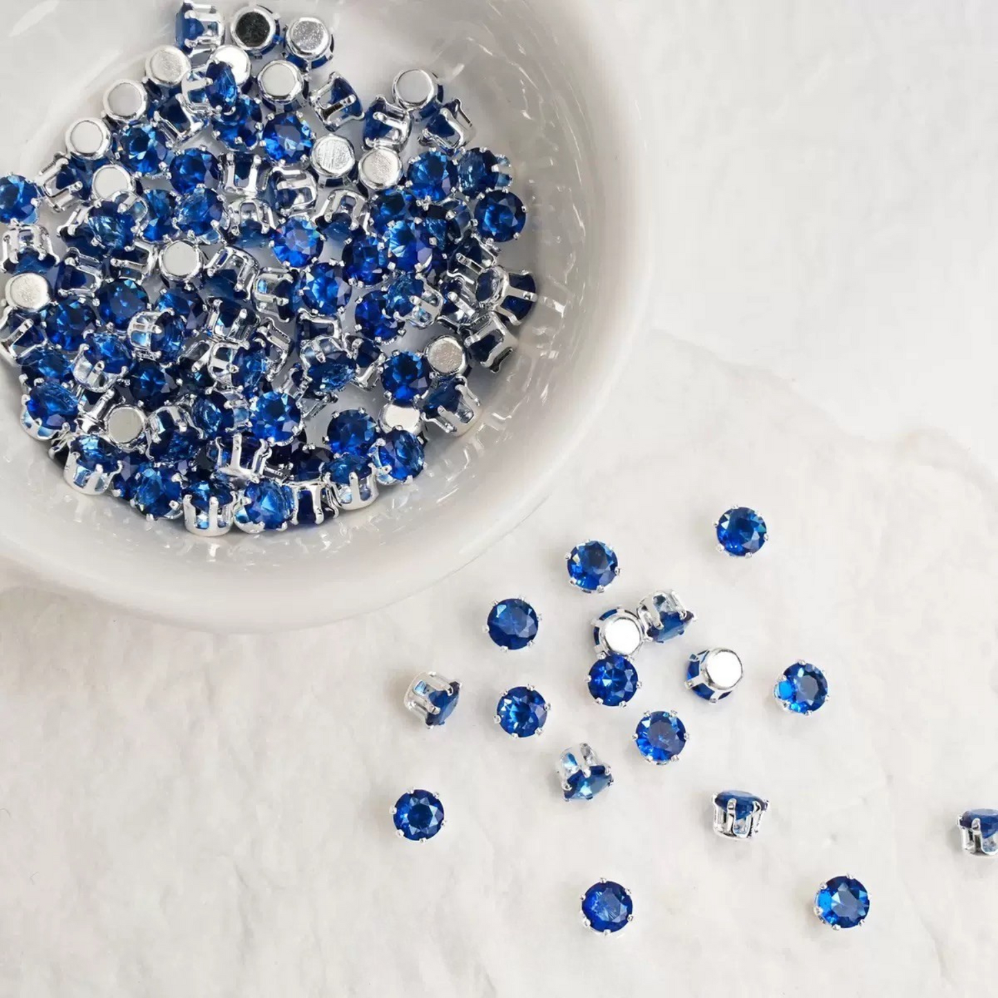 navy blue claw-set zirconia stones