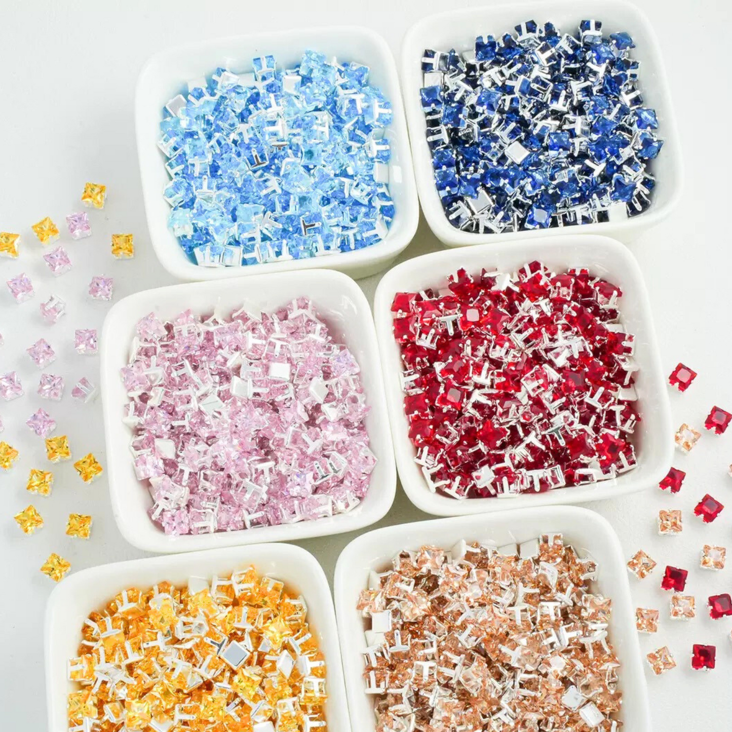 Square-shaped faux diamonds with silver claws