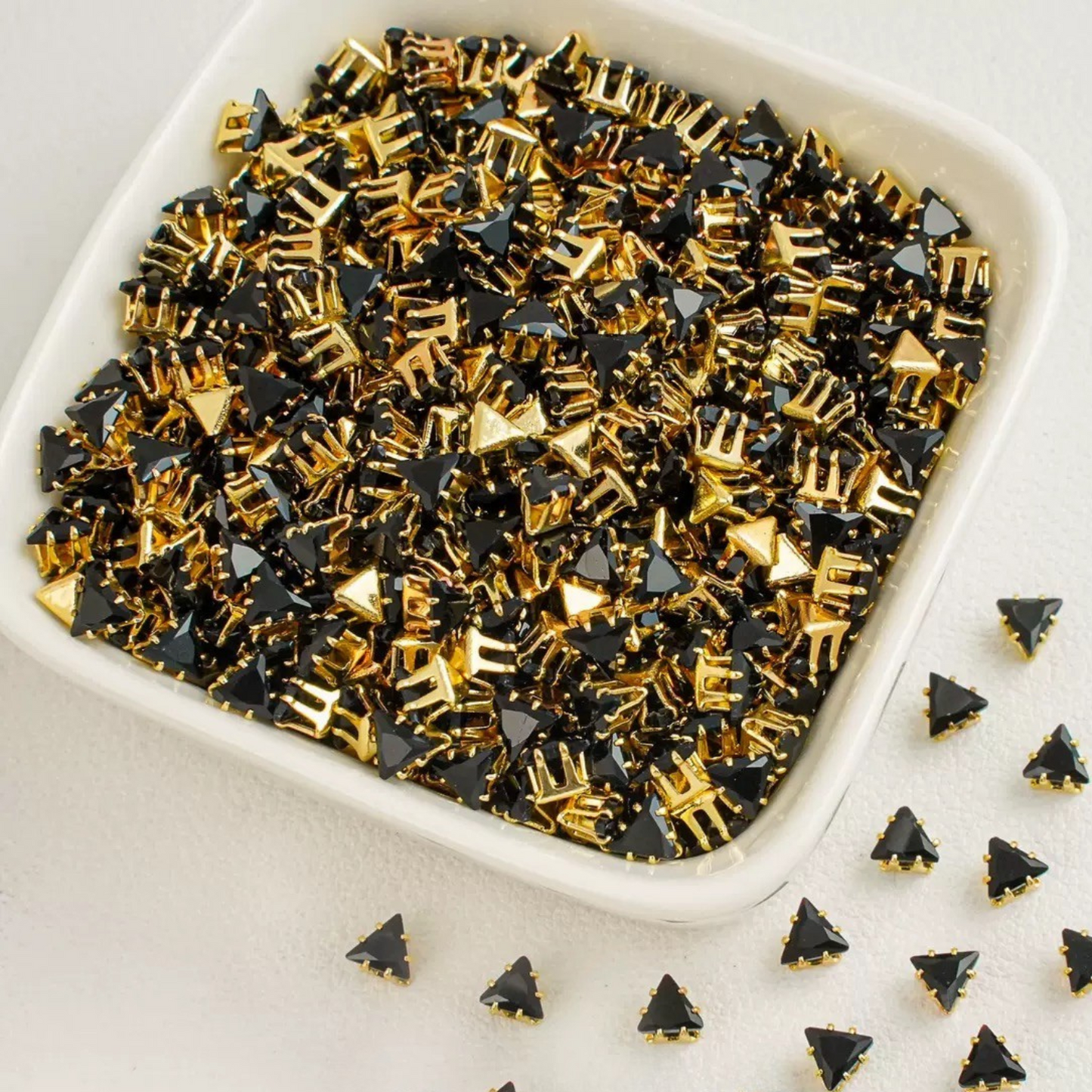 Triangle-shaped black zircon beads with gold base