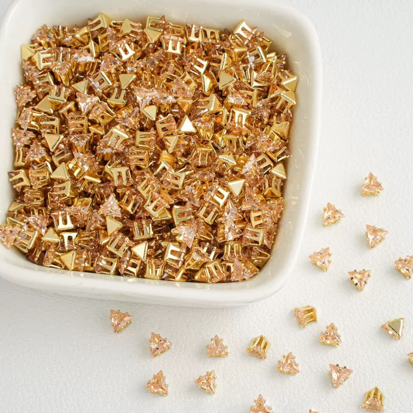 Triangle-shaped champagne zircon beads with gold base