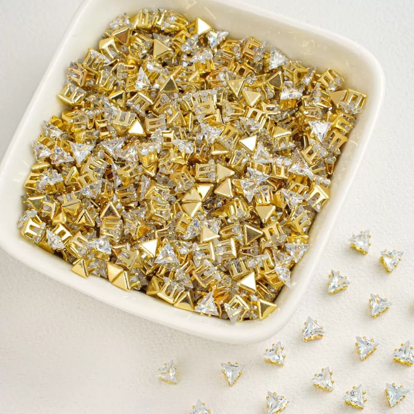 Triangle-shaped clear zircon beads with gold base