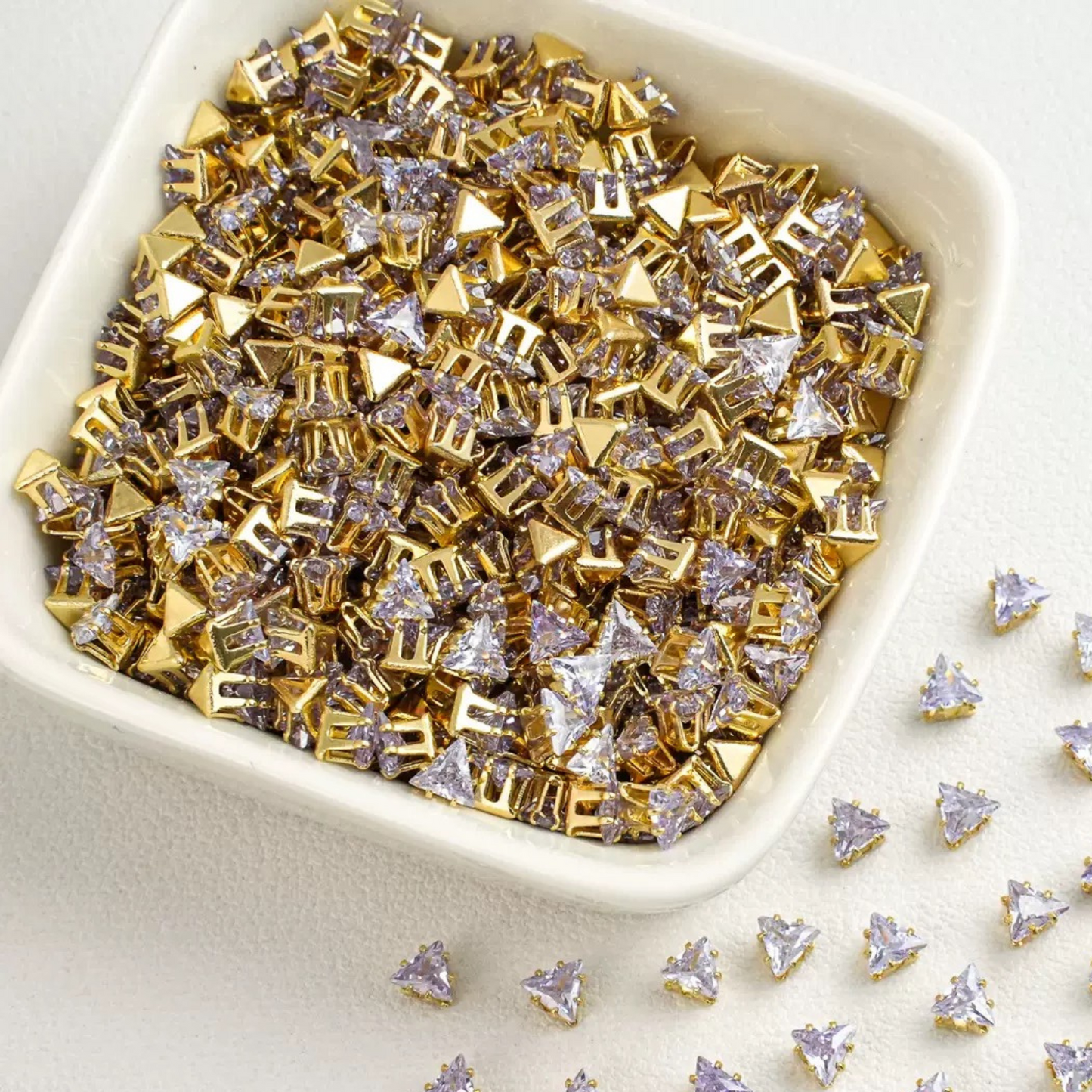 Triangle-shaped light purple zircon beads with gold base