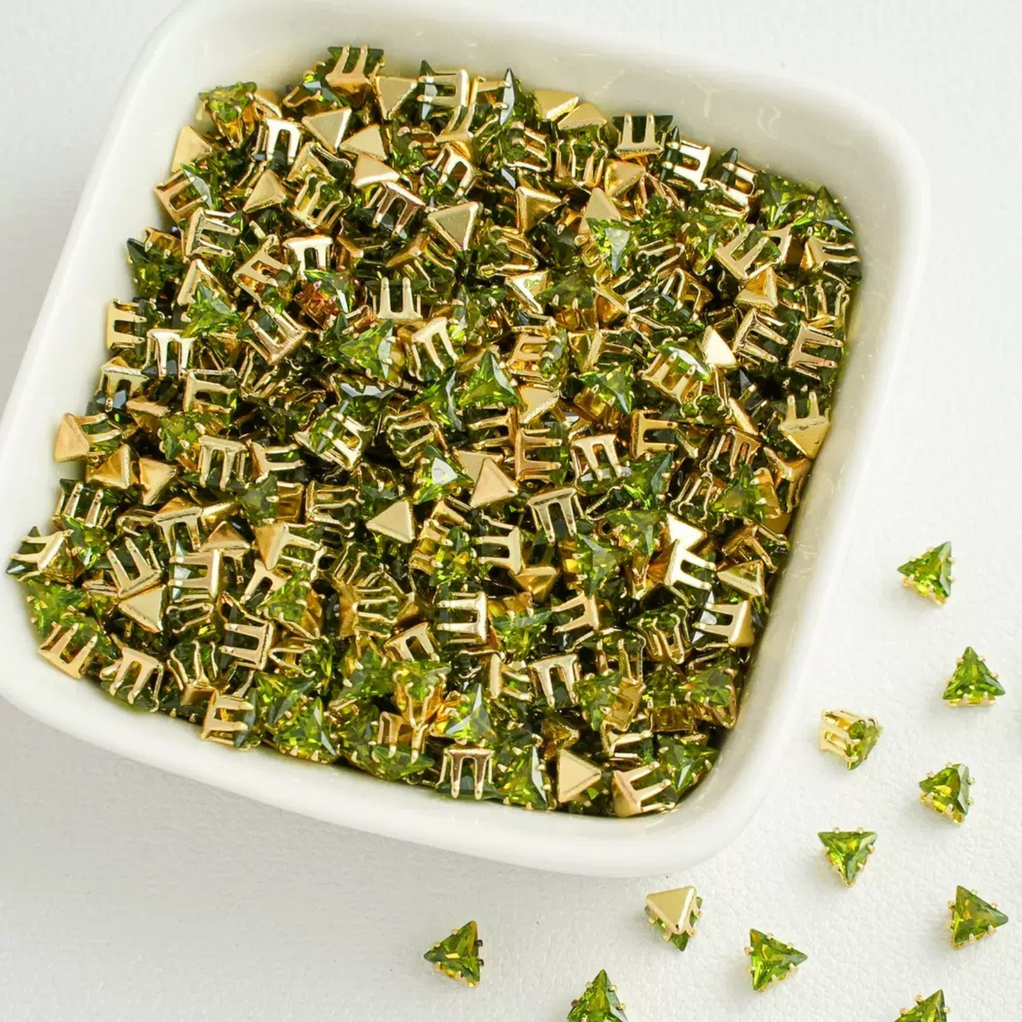 Triangle-shaped olive green zircon beads with gold base