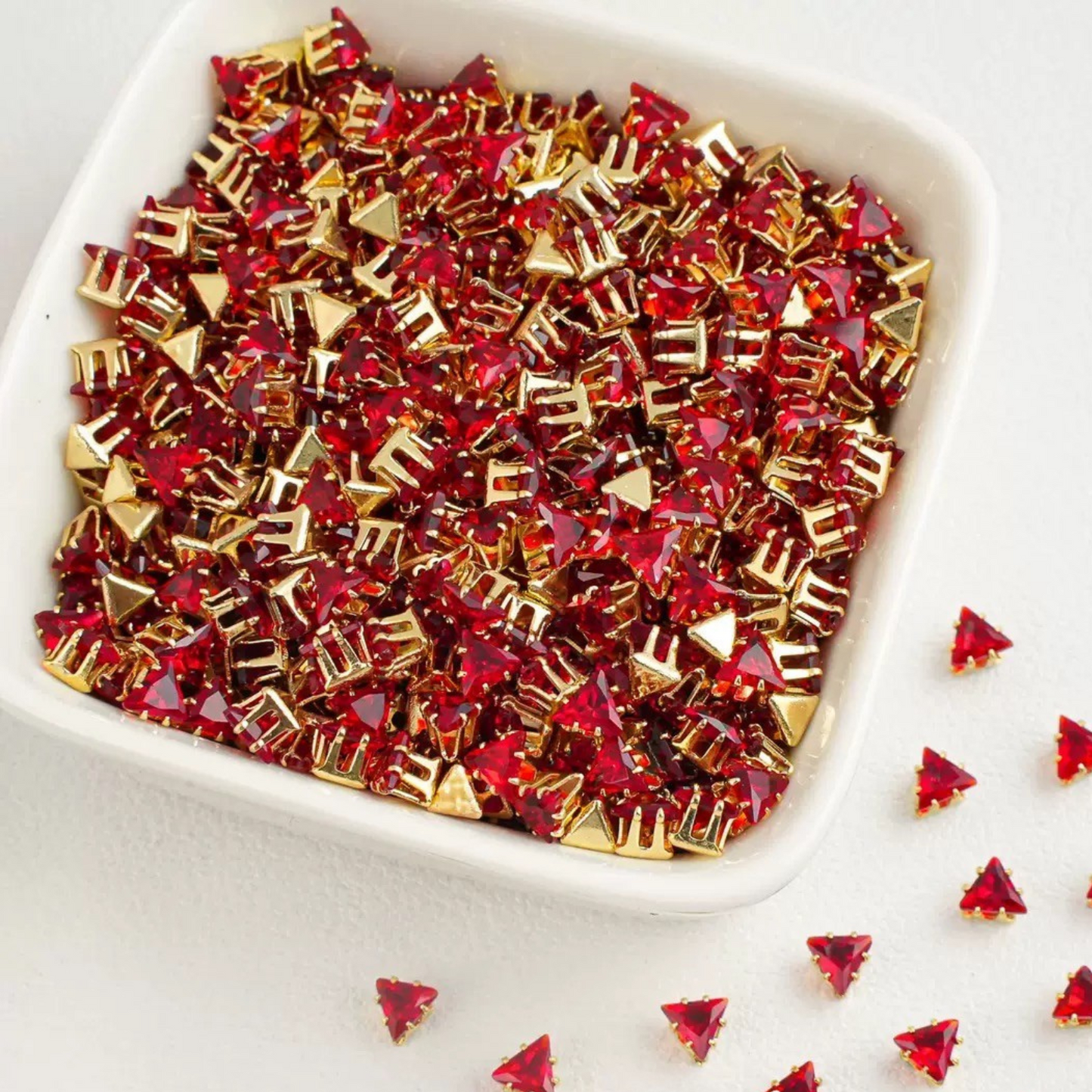 Triangle-shaped red zircon beads with gold base