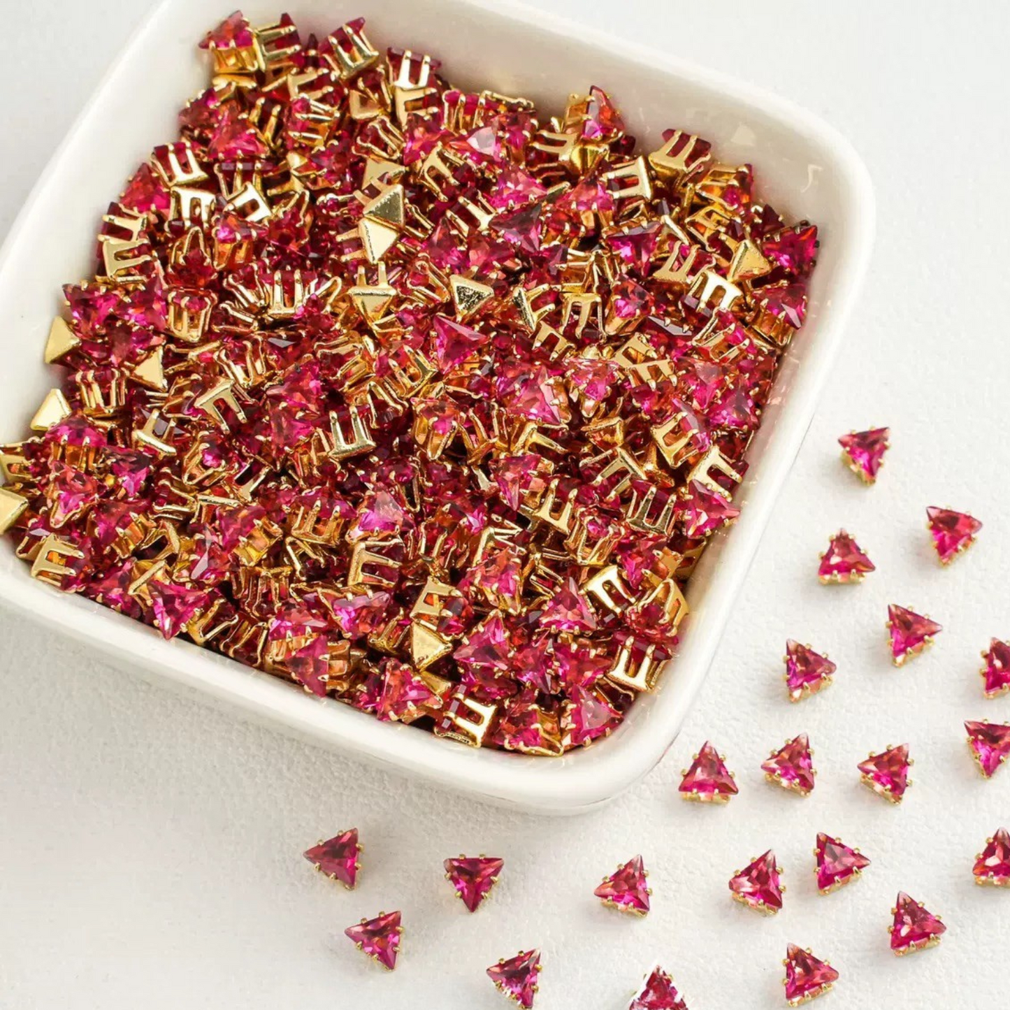Triangle-shaped rose pink zircon beads with gold base