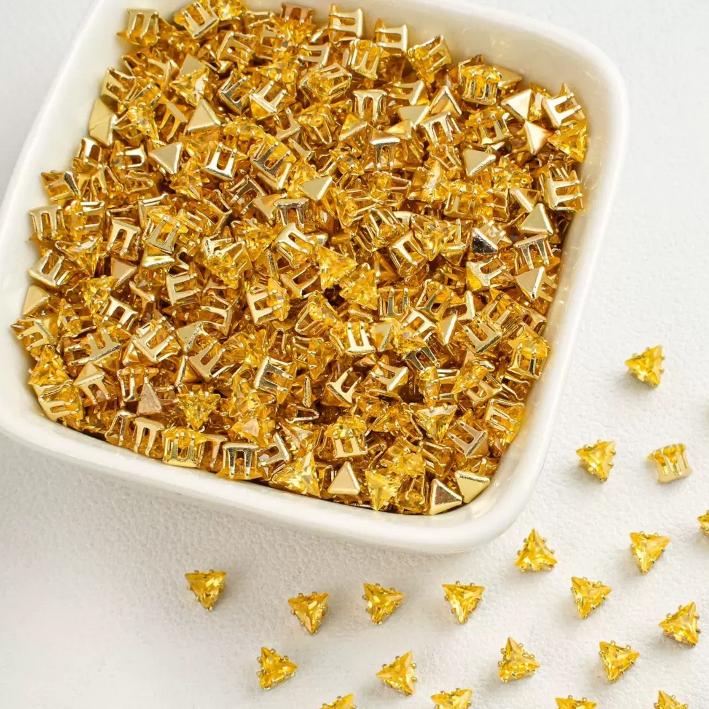 Triangle-shaped yellow zircon beads with gold base