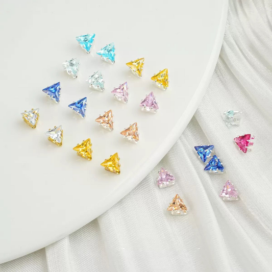Faceted triangle zirconia beads set on silver backing