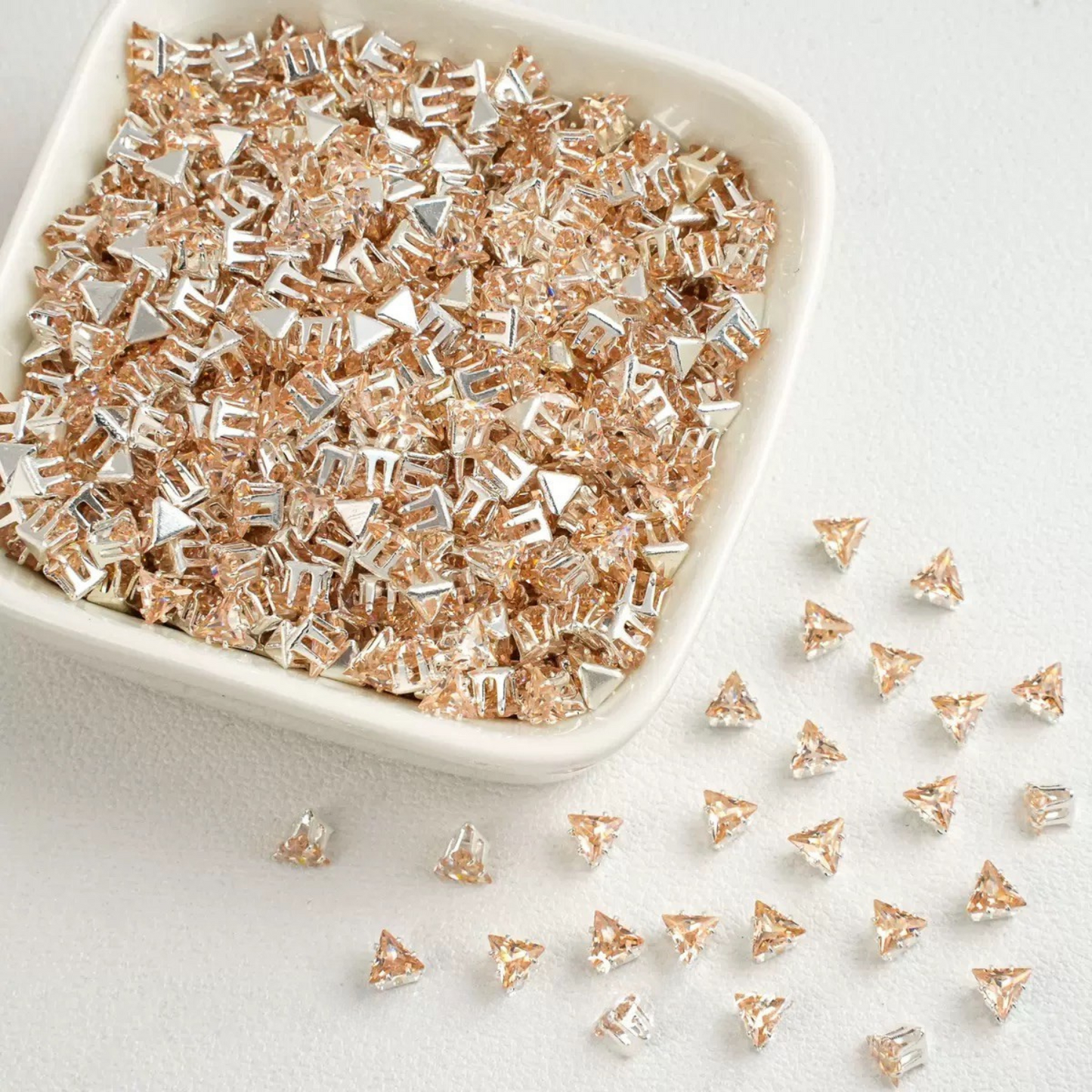 Champagne faceted triangle zirconia beads set on silver backing