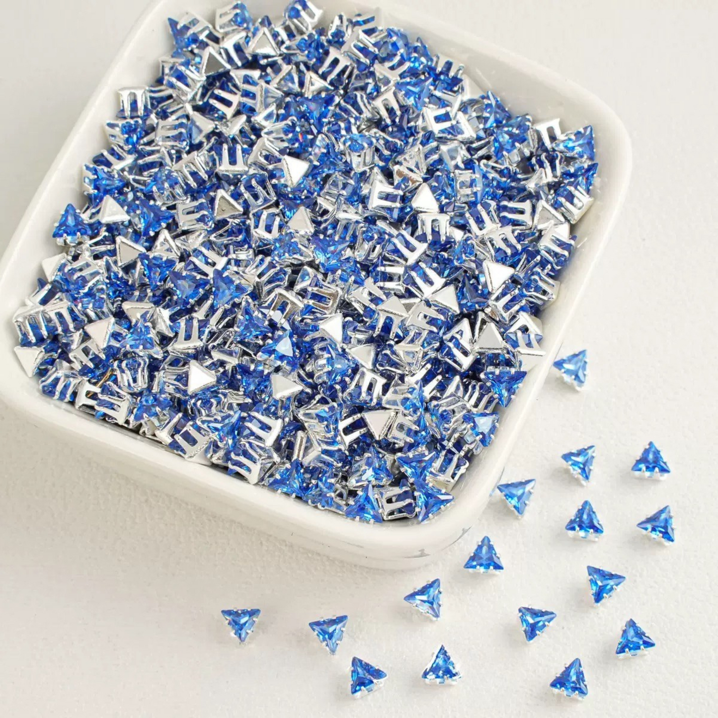 Ocean blue faceted triangle zirconia beads set on silver backing