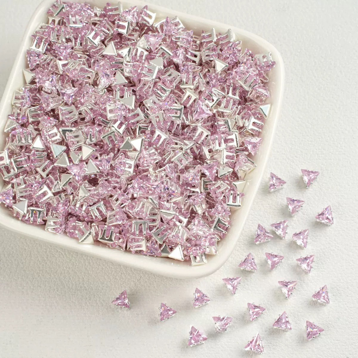 Pink faceted triangle zirconia beads set on silver backing