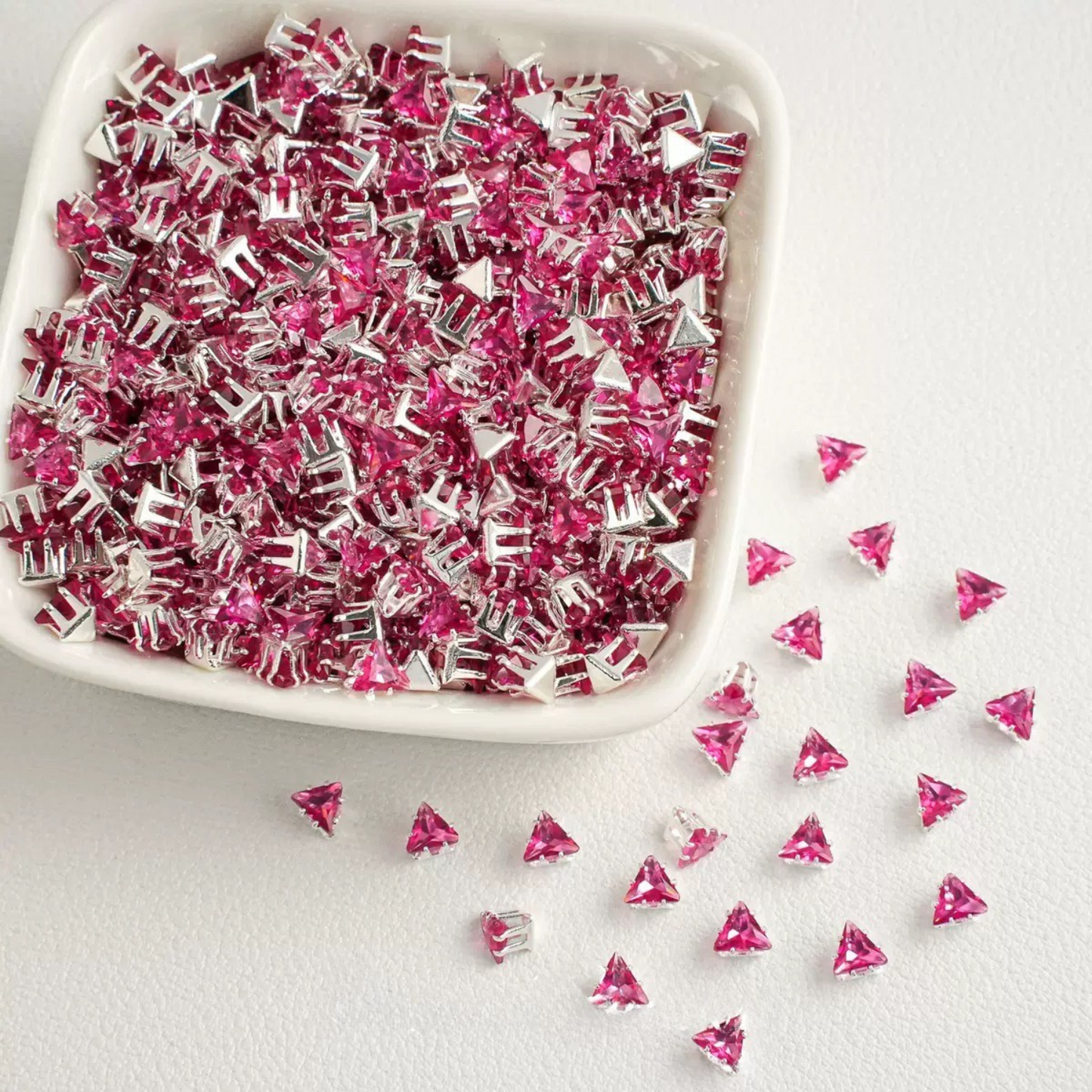 Rose pink faceted triangle zirconia beads set on silver backing