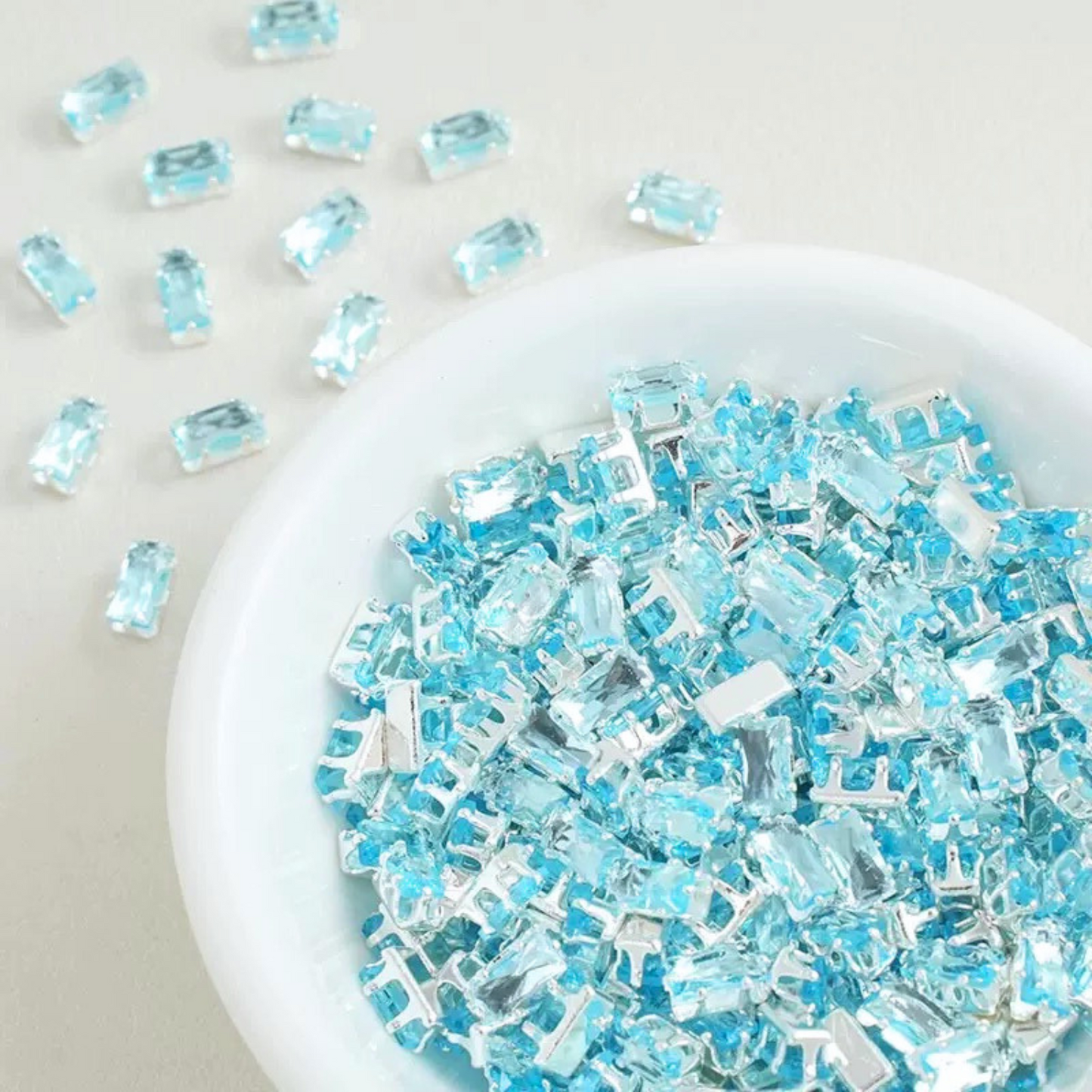Rectangular cubic zirconia gems in sky bue